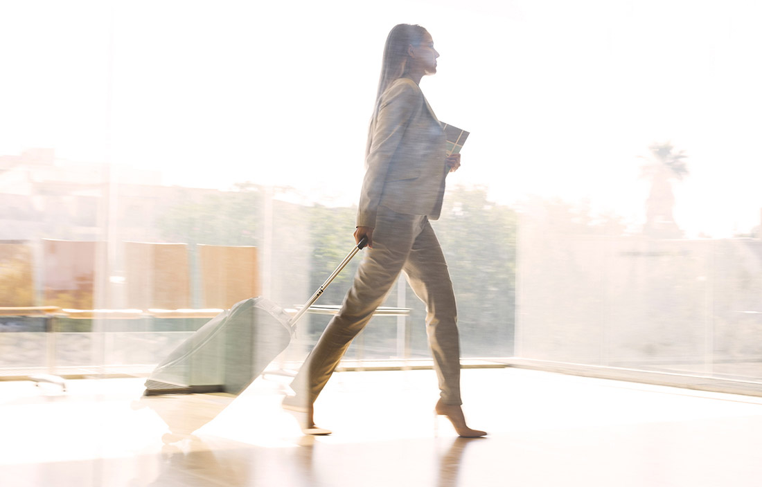 Woman walking through airport