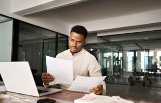 Business professional reviewing their documents.