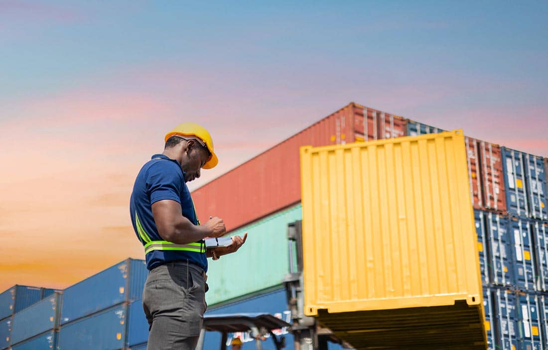 Construction worker keeping track of shipments.
